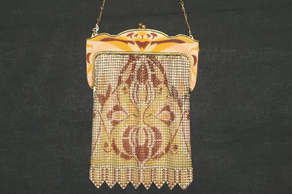 Whiting & Davis Enamel Handbag: 1940s Stenciled Deco designed frame, 7 1/2", light wear, but some fading 1 side. For Bigger and Better photos or information about consigning in our future events go to our website