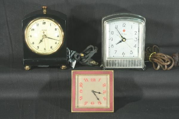 3 Art Deco Clocks: 1931 Telechron Dura-Alloy Telealarm model 711. B Altman Brass table clock, Swiss movement. 1932 Hammond "Firefly" model, synchronous Bakelite with plated feet & finial, 6" t. Clocks, Radios and other