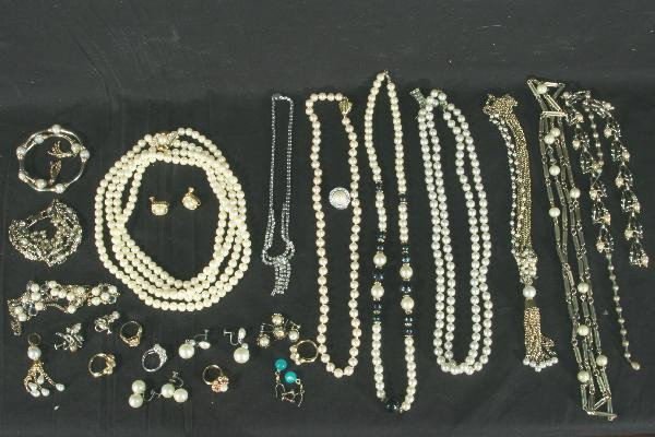 25 Plus Piece Vintage Costume Jewelry Lot: Assorted necklaces, bracelets, rings and earrings. All show signs of use. For Bigger and Better photos or information about consigning in our future events go to our website