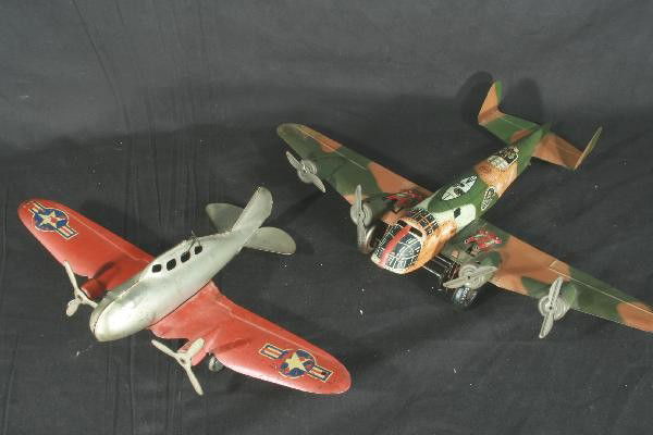 2 Toy Airplanes Lot: Marx Military Bomber, straight smooth 16" wings, some rust on end of main wing, no spring. Wyandotte Air Force plane, 16" wing span, decals worn. For Bigger and Better photos or information about cons