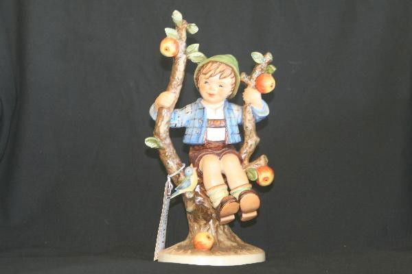 Hummel Apple Tree Boy 142/5: 10 1/2" Tall, stamped Goebel, small V, 1968. Minute flake at tip of heist leaf. Free From Cracks Flakes and Chips. For Bigger and Better photos or information about consigning in our future events go