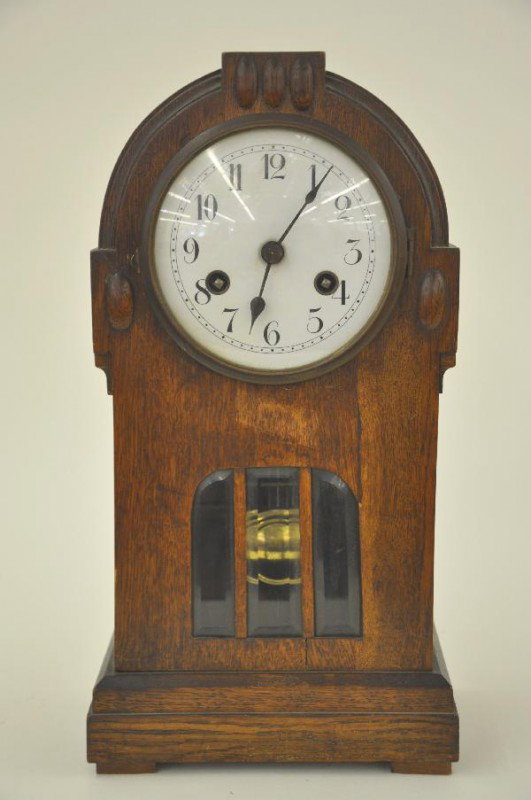 Oak Case German Clock with Beveled Glass: 15 1/2" Tall, clean, 3-panel beveled glass pendulum window, no maker marked, works stamped made in Wurtzberg, 25CM For Bigger and Better photos or information about consigning in our future events go 