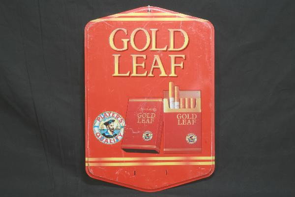 Tin Gold Leaf Cigarette Sign: Shows moderate wear, but has rich color, 11 1/2 X 17". For Bigger and Better photos or information about consigning in our future events go to our website