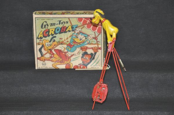 Scarce Boxed Marx Disney Pluto Acrobat: Line Mar, Gym-Toys label, like new example of this fragile toy, 9" Tall, functional, great graphics on original box. For Bigger and Better photos or information about consigning in our future events g