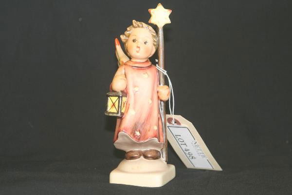 Hummel Christmas Song 343: 6 1/2" Tall, stamped Goebel. Otherwise free from chips, flakes & cracks. For Bigger and Better photos or information about consigning in our future events go to our website