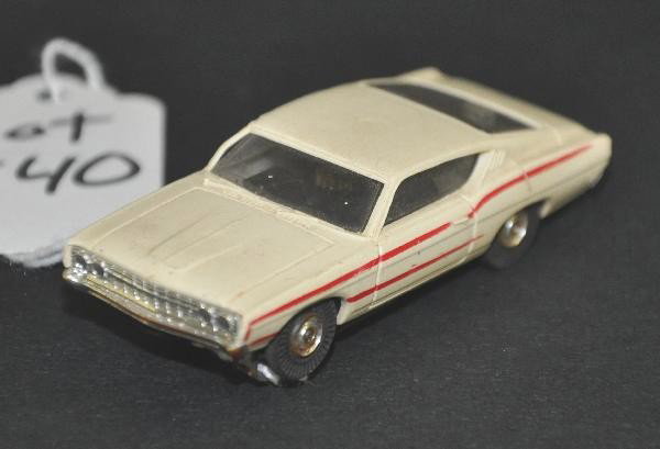 Aurora T-Jet Ford Torino Slot Car: Struts intact with nice pin stripping, dusty, shows moderate playwear. For Bigger and Better photos or information about consigning in our future events go to our website