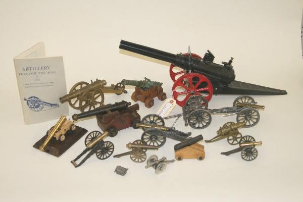 15 Pc. Cannon, Mortar & Field Gun Lot: Largest is Big Bang at 23" Long, Pewter, Brass & Wood various sizes and ages. For Bigger and Better photos or information about consigning in our future events go to our website