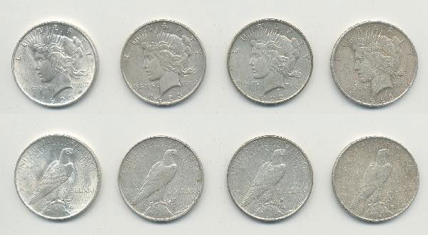 4 Peace Dollars.: Includes: 1923-D, 1923, 1922, 1922. In our opinion, grade this lot as F to XF. View picture carefully to determine condition. For Bigger and Better photos or information about consigning in our future