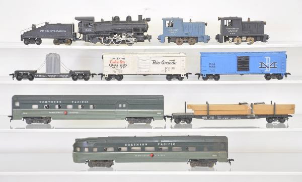 9 Pc. American Flyer HO Gauge Lot: 433 PRR 0-6-0 switcher & tender; 503 transformer car; 31021 ITS Diesel; 522 B&M Boxcar, 33523 RG Cookie Box; 513 NH Lumber flat, several broken stakes; 33540 NP Combine; 31013 ITS Diesel 33543 NP Obse