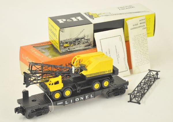 Unrun Boxed Lionel 6828 Flat with P&H Crane: Later version with scarce Cellophane window ob; complete with sealed packet & instructions, flat with band is unrun, original boxes are square but have some light staining, car is Factory New.