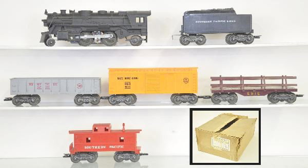Unusual Marx/Montgomery Wards Set 52345: 666 Cast loco with smoke & fluid; SP tender; PRR Gondola; Erie Railed Flat with package loads; Orange B&O Boxcar; SP Caboose; 2 boxed 072 Lampposts; 3pc Accessory set boxed; bumper; telephone poles; F