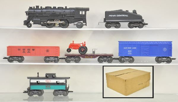 Unrun Boxed Marx Set 50385MO: 1666 Plastic steam Loco with smoke appears to be lightly run, PC Wedge tender; Erie Flat with red tractor, missing 1; PRR Gondola in salmon red; B&O Boxcar; 18326 NYC Caboose; all unrun, Black Water t