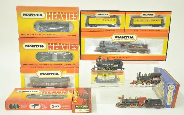 11 Pc. HO Ga. Lot: 4 Pc. Mantua Military lot, dummy loco; Mantua Plymouth Diesel; Mantua Street car kit; Mantua Old-time train set, 4-8-0 loco with 2 passenger cars, set box bottom; Mantua Stock Car; all original boxes.