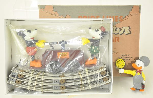 Boxed Pride Lines Set: 1100 Mickey Mouse train set with track and 1984 Donald Duck Figure. Factory New.