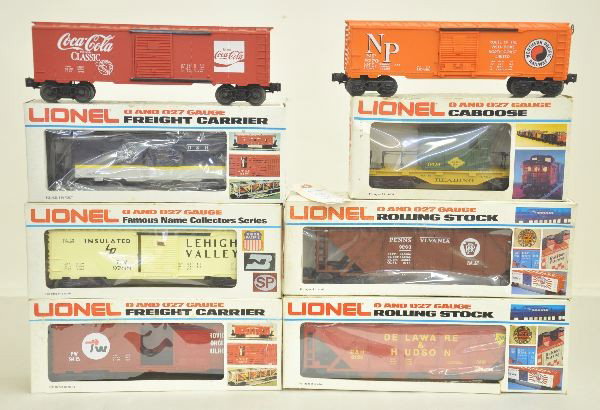 7 Boxed Lionel O-gauge Cars: 6-9788 Lehigh Valley boxcar; 6-9355 D&H bay window caboose; 6-6124 Delaware & Hudson covered hopper; 6-9415 Providence & Worchester boxcar; 6-6426 Reading maintenance caboose; Promotional coke classic