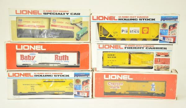 6 Boxed Lionel O-gauge Cars: 6-9854 Baby Ruth reefer car; 6-9853 Rare caramel color Cracker Jack reefer car, coupon missing; 6-9383 Union Pacific Famous American R.R. piggyback flat car with vans; 6-9819 Famous American R.R. Grea