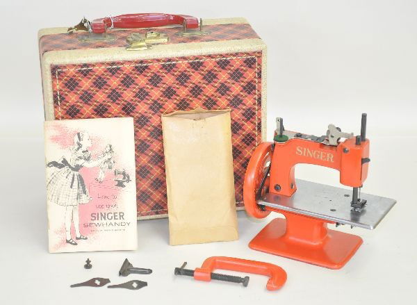 Boxed Singer #20 Sewing Machine: Fantastic condition miniature sewing machine with original suitcase and accessories, instructions dated 1953. Shows light use.