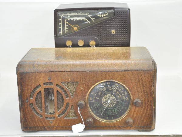Two Art Deco Radios: Zenith #14957 which has plascon case; two-tone, D723, tube type, regular and Swiss band in wooden case 18" wide, speaker screen has tear, case is worn. Both sold as untested.