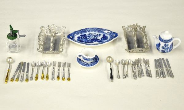 Group of Miniatures: Hand mixer, tea pot, coffee cup and saucer, porcelain platter, two silver ware trays with many pieces, on set has gold foiled handles Overall nice condition