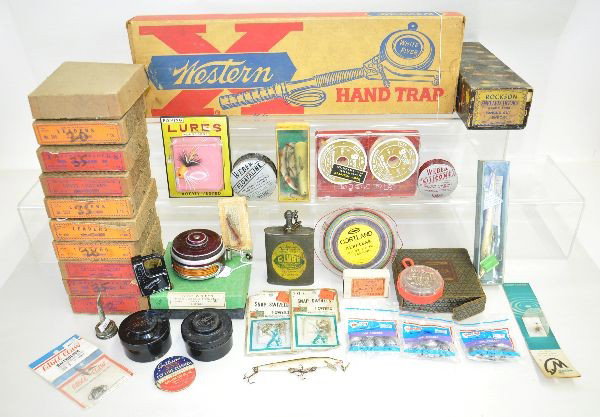 40 pc Plus Fishing and Sports Lot: Includes dozens fishing items, including two Mitchell large reels in containers, two Brooks lures in box, Western hand trap launcher, gun and tackle lube can with top, several level leaders in boxes, 