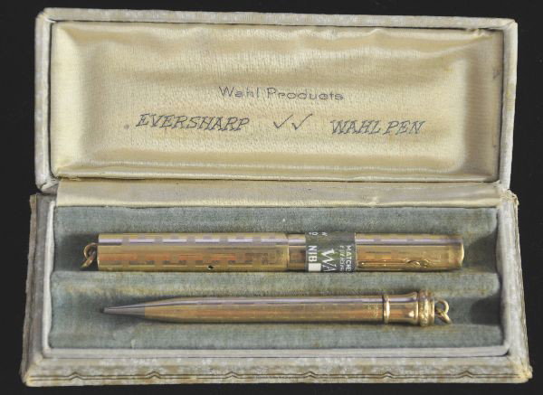 Boxed Wahl & Eversharp Pen & Pencil Set: Circa 1920s, Matched pair with original store tag, pencil is 3.5" long and pen is 3 5/8" long capped, gold filled cases with original box, minor wear from use, nice to see a set of this age intact.