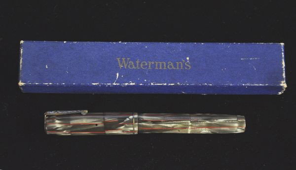 Boxed Watermans Ideal Fountain Pen: 4 1/4", Mottled green with red stripes, has ink stains on case. Original nip needs a cleaning, plating on clip & lever shows wear. Stylish design with original box.