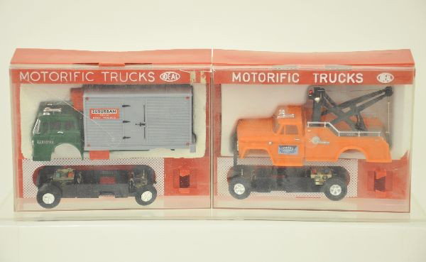 Two Ideal Motorific Slot Car Trucks: Road service wrecker and Suburban Freight Delivery box truck. Both complete with original boxes and show light playwear.