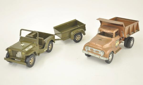 Three Piece Tonka Truck Lot: 1957 Hydraulic Dump Truck, Complete but hydraulic not working. Decals 100% could use a cleaning. Shows light to moderate playwear. 1964 Army Jeep and Trailer Set #384, both very clean and shiny, Jeep 