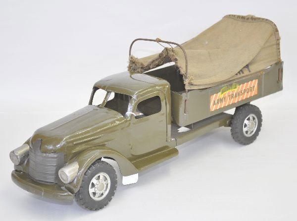 1940's Buddy L Army Transport Truck: 21" Pressed steel with rubber tires, original canvass back (torn one side), decals 90% clean and shiny. Otherwise shows light to moderate playwear.