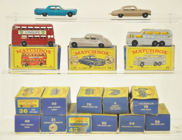 14 pc Matchbox Vehicle and Empty Box Lot: 5 Matchbox cars with original boxes and 9 empty boxes. Model 31 Lincoln Continental with box, Model 66 Greyhound Coach with box, Model 44 Rolls Royce Phantom V with box, Model 5 London Bus with box, M
