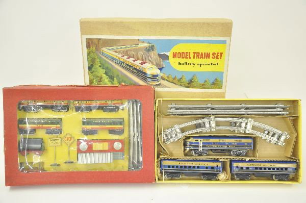 Two Boxed Japanese Battery Operated Tin Train Sets: Baltimore and Ohio diesel passenger set, locomotive, coach and observation. S-gauge size in set box with inserts and packing. San Union Pacific deluxe passenger freight set, includes battery operated 