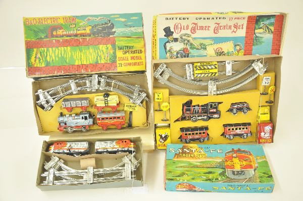 Three Tin Toy Train Sets: Three boxed train sets. Mechanical Alps Santa Fe AA Diesel train , mechanism functional, track, set box with inserts; Battery operated Japanese tin, San B & O Electric four car train, track and sign a