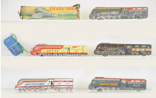 5 Litho Tin Train Toys: All similar style and size, one Santa Fe, marked 'Made in Italy", 3 silver trains, different variations marked San one shows moderate playwear, and Royal battery operated with original controller, oth