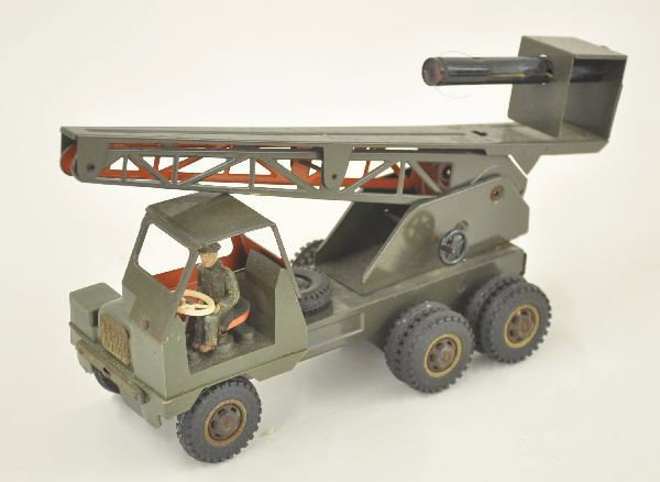 Unusual Strenco Mobile Rocket Launcher: Litho tin friction, 12" long, elevator functional, composition driver clean and shiny but chrome pieces shows rust.