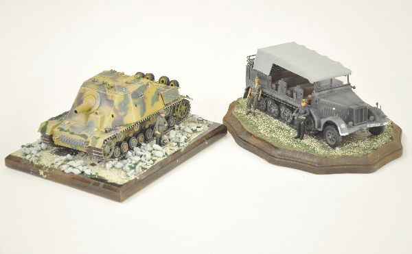 Two highly Detailed Military Dioramas: 9" x 7" wooden base displaying a German Tank with commander, tank is a well-painted metal unit, nicely portrayed. Second piece is an 11" scalloped oval wooden base displaying half track and crew, well