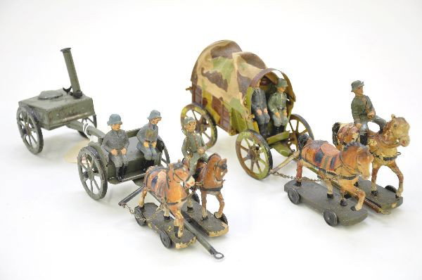 Two Lineol Horse Drawn Military Vehicles: Covered Wagon with original canvas, three figures, one horse heavily flaked; Field kitchen, with three figures, rider missing pin. Otherwise shows moderate playwear