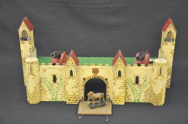 4 pc Rich Toys Fort: 24" x 8 1/2 " painted and stenciled wood fort, with drawbridge, two wooden cannons, and Lineol horse on wheels. Drawbridge is hinged and functional. Only missing flags. Clean and bright. Light to mode