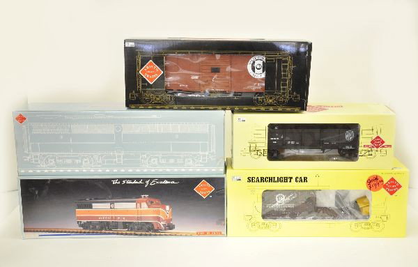 5 Boxed G-Gauge Aristocraft Trains: ART-22018 Alco FA-1 Diesel engine; ART-22068 Alco FB-1 Diesel engine; ART-81004 Wood gondola car; ART-56028 Steel boxcar; ART-46361 PA R.R. Searchlight car. Otherwise, shows light playwear.