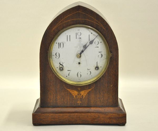 Seth Thomas Beehive Mantle Clock: Early 1900's 11" tall, working. Mahogany case with maple inlay, nice aged patina, showing light crazing to finish, metal face is bright shows normal wear near windings. Face needs securing.