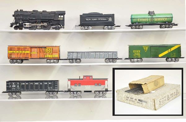 Scarce Boxed Marx Set 25242 and 25240X: This unusual set has the accessory set glued to the top of the set box. It is the first we have seen. Main set 25242 includes 999 steam engine, NYC tender, Santa Fe stock car, city service tank car, G