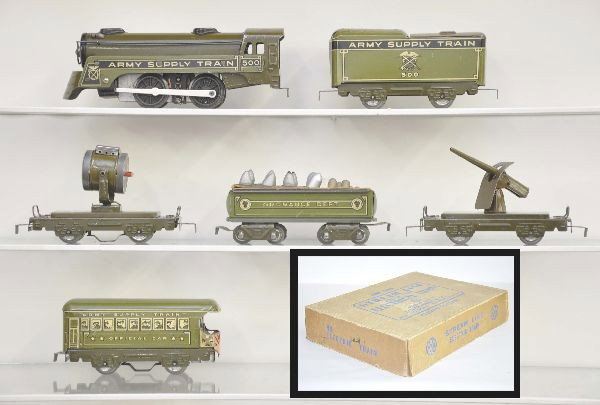 Boxed Marx Army Set 5926: 500 AST steam locomotive, four wheel 500 AST tender, 8 wheel ordnance dept gondola, with original insert and 11 original shells, electric searchlight car, anti-aircraft gun, official car with illumina