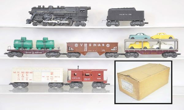 Boxed Marx Montgomery Ward Set 56845: 1829 Hudson Locomotive, Santa Fe tender, PFE reefer, SOU auto loader, Virginian hopper, city service flat with tanks, logo on ends version, Santa Fe bay window caboose. Includes track, switch and tran