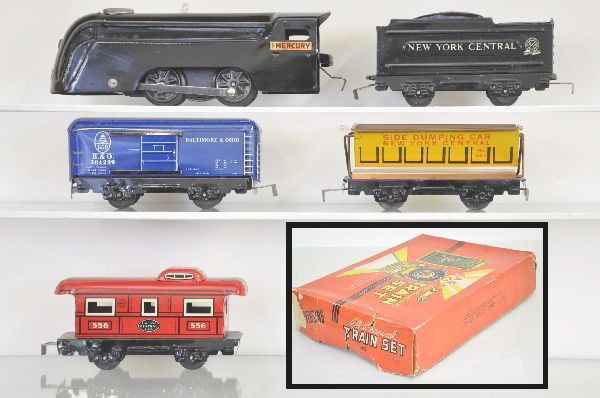 Unusual Boxed Marx Mercury Set: Mercury locomotive with whistle, and NYC 4 wheel tender 567 side dumping car, B&O boxcar, 556 caboose, track and switches. Condition: loco mechanism and whistle are functional with key and envelope. L