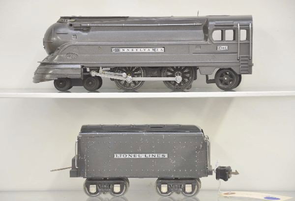 Lionel 238E Pennsylvania Torpedo Locomotive: Clean and shiny with 265W tender, gun metal. Condition: Missing one running light, shows light to moderate playwear. C7