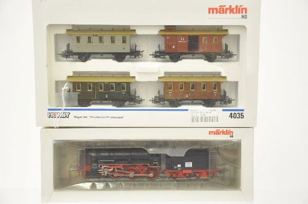 Marklin HO Gauge Passenger Set: 3098 BR38 4-6-0 steam locomotive with a 4035 Prussian four car assortment. All show light playwear, original boxes. C8