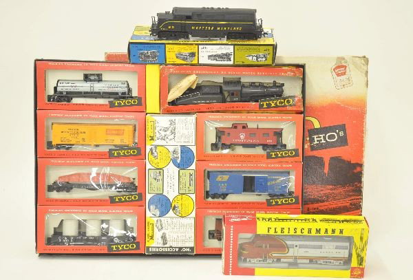 Three Unit HO Gauge Lot: Fleischmann 1341S Santa Fe Alco Diesel, AHM Western Maryland BL-2 diesel, no insert in box. Tyco set T6117 The Red Bird East which includes, B&O steam switcher and tender, 7 freight cars, missing trac