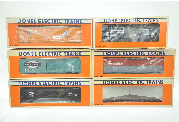 6 Boxed Lionel NYC Freight Cars: 9815 reefer, 6208 gondola, 17221 boxcar, 9469 boxcar, 9521 flat with stakes, 19726 bay window caboose. All unrun, original boxes. Factory new. C9