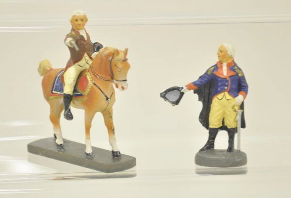 3 pc Elastolin George Washington Figure Lot: Mounted figure with drawn sword and standing in full dress uniform. Paint is unusually bright and clean. Mounted piece has minor age cracks. Otherwise, C8