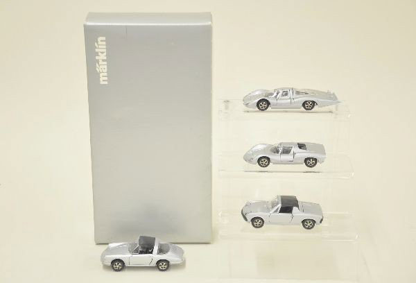 Boxed Modern Marklin 4 pc Porsche Vehicle Assortmen: All Dinky and Corgi sized diecast vehicles. Includes 911T, 914, 907, and 910. Original box. Clear insert yellowed. Otherwise, C9.