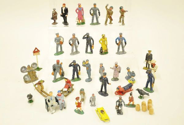 38 pc American and French Dimestores: Mostly civilian with a few pod foot figures included. French skier missing pole, sitting figure with sled. Most show moderate to heavy playwear. C5-6